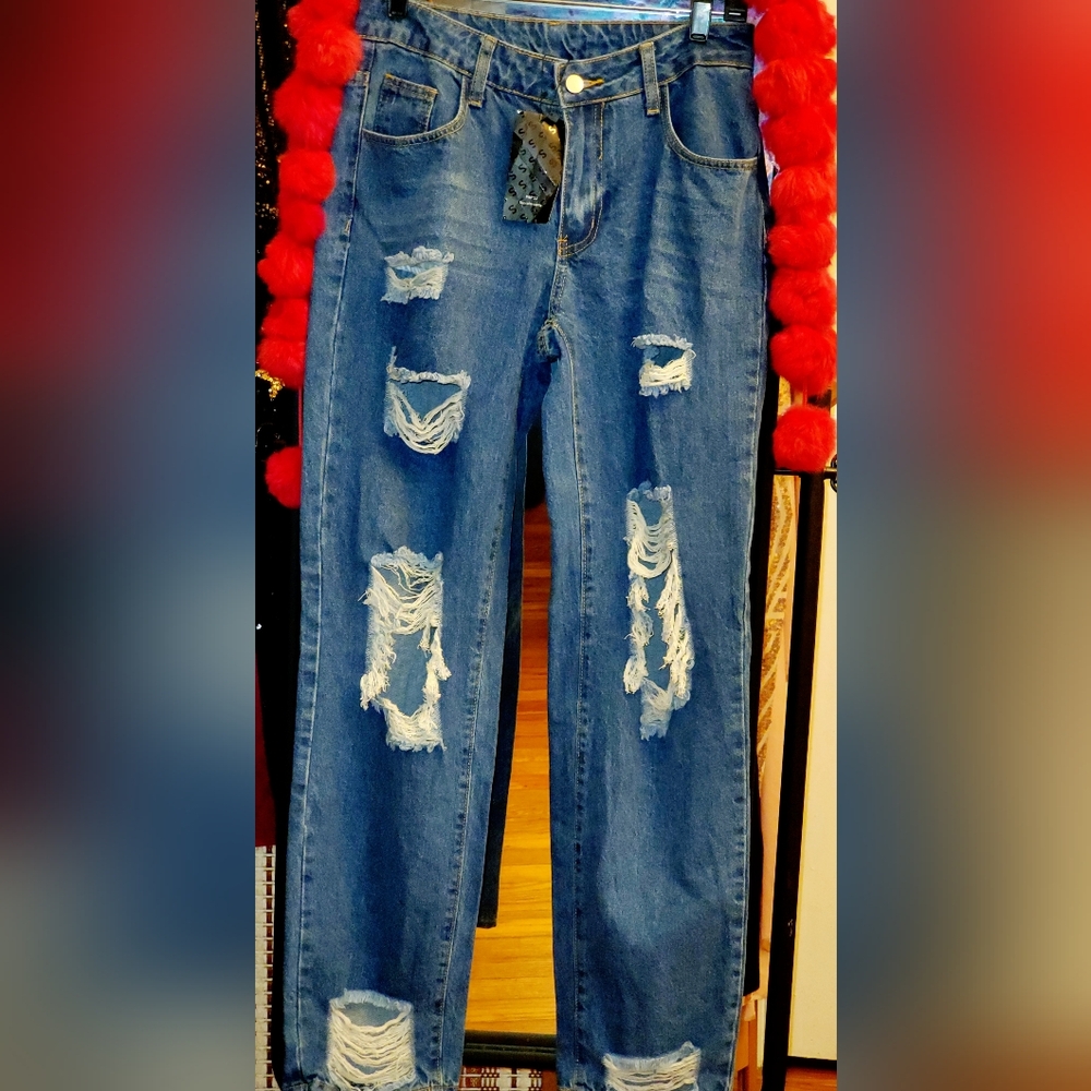 Distressed blue denim jeans